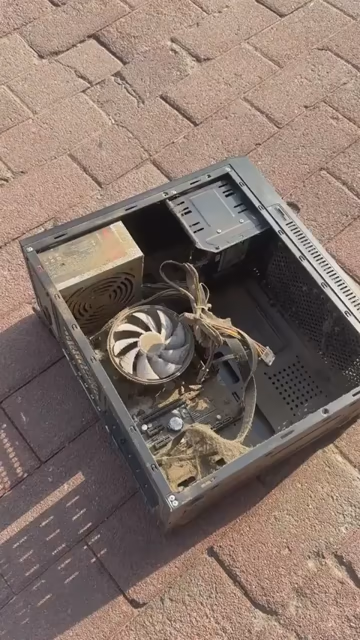 Video of someone with an dusty computer with open chassis sitting on the ground outside. They crank up a leaf blower to dust it off, and OH BOY, does dust come flying out. The more they blow, the bigger the dust cloud gets.
