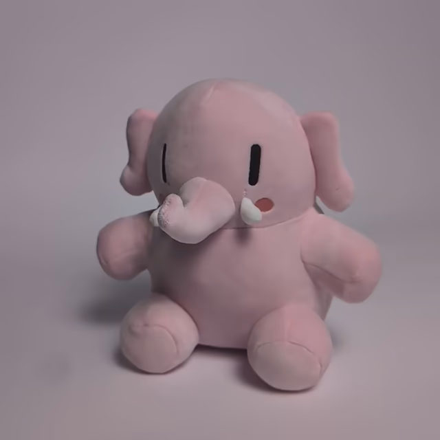 A pink 20cm Mastodon stuffed toy being picked up and squished like a marshmallow in slow motion.